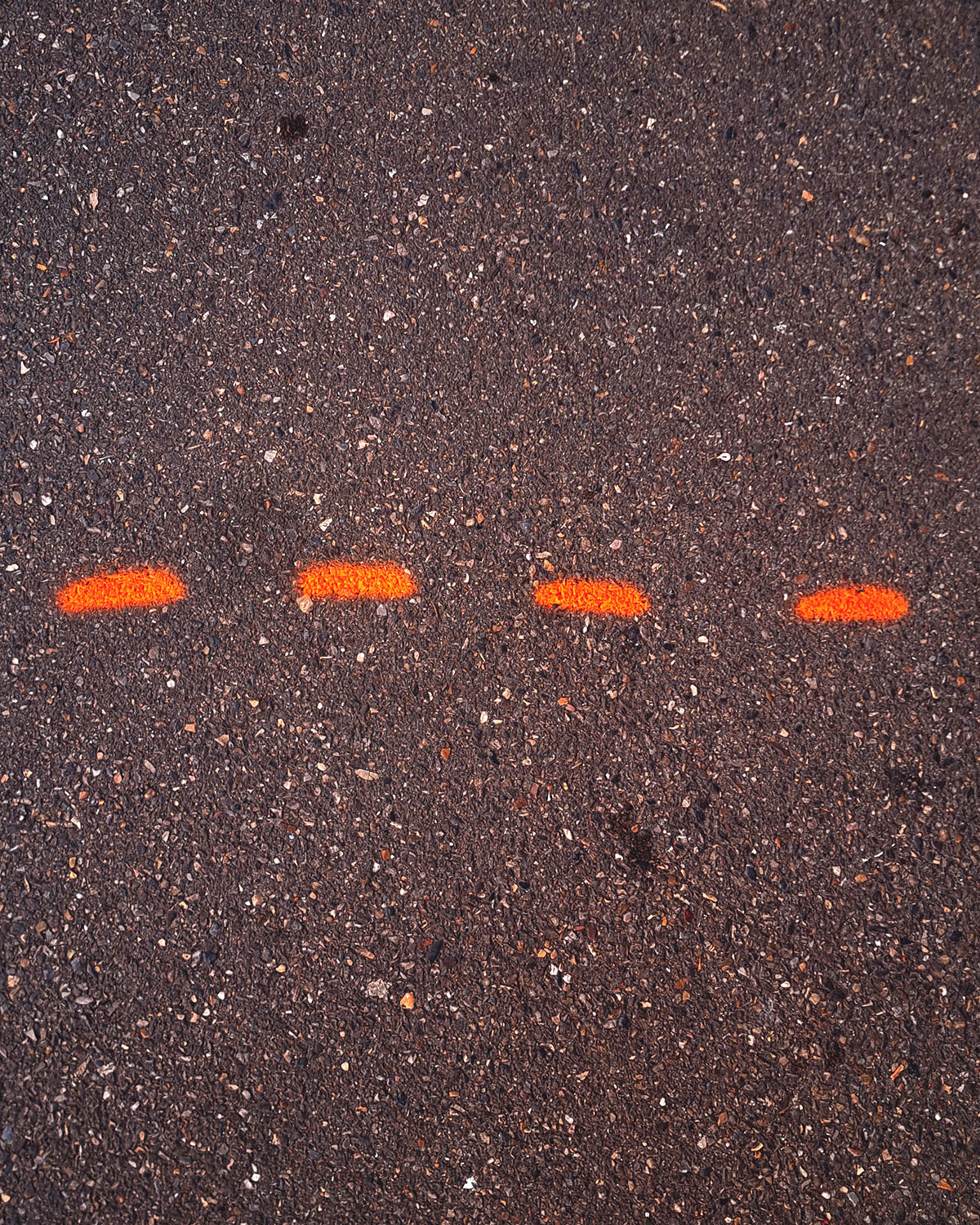 Orange markings on the ground